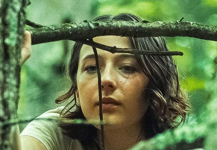 Girl with branches in front of her