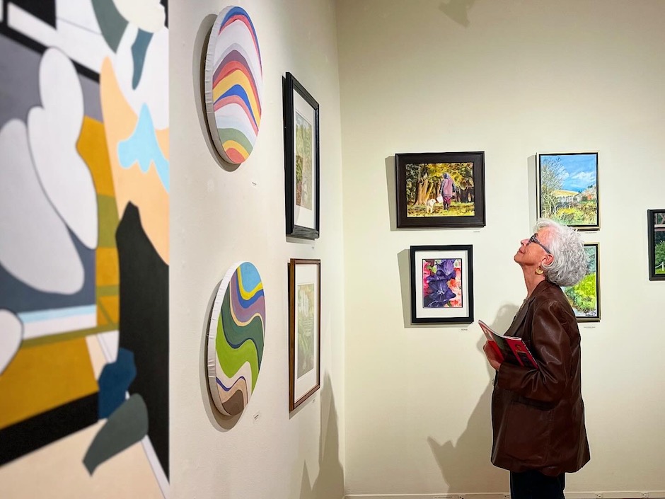 woman looking at art in gallery