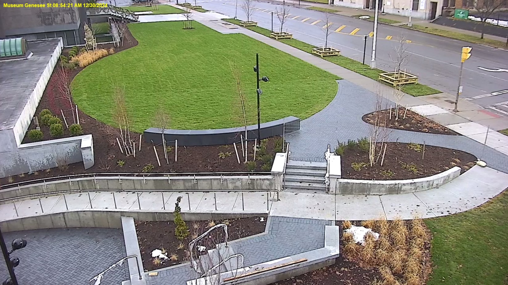 View of Genesee Street front lawn, the ramp is mostly completed and the trees and shrubs are planted.