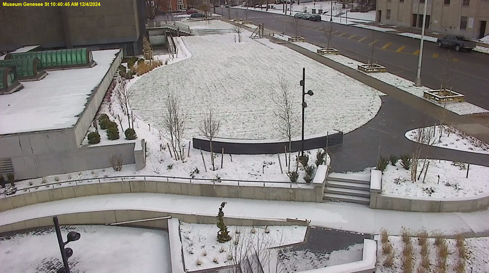 View of Genesee Street front lawn, the ramp is mostly completed and the trees and shrubs are planted.